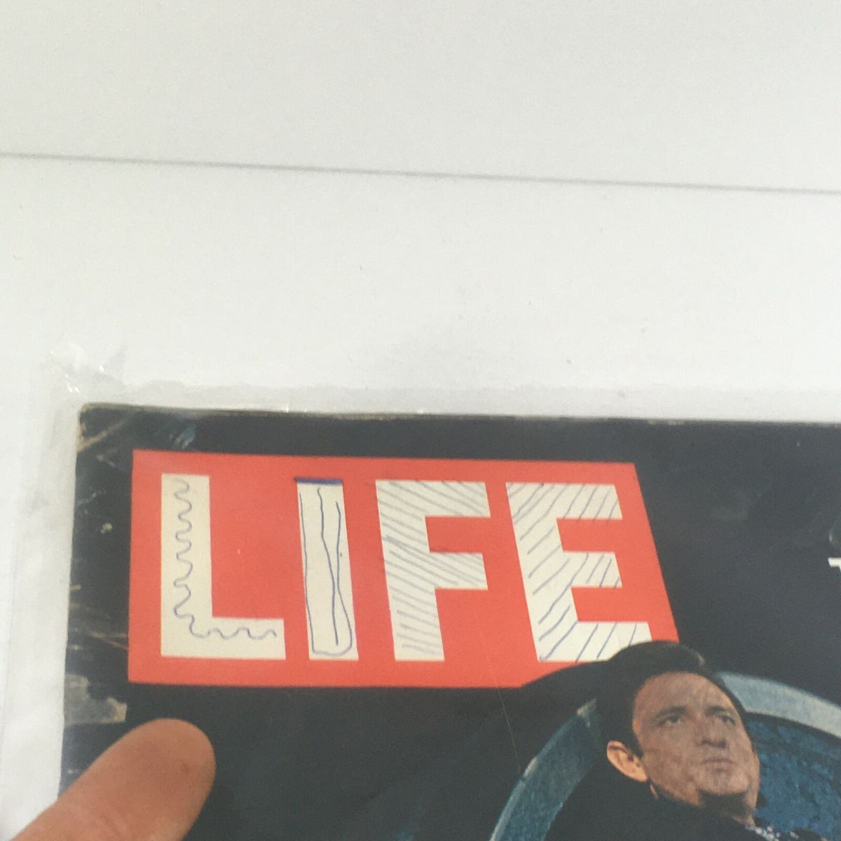 Close-up of the Life Magazine title from the November 21, 1969 issue showcasing Johnny Cash, the Rough-cut King of Country Music.