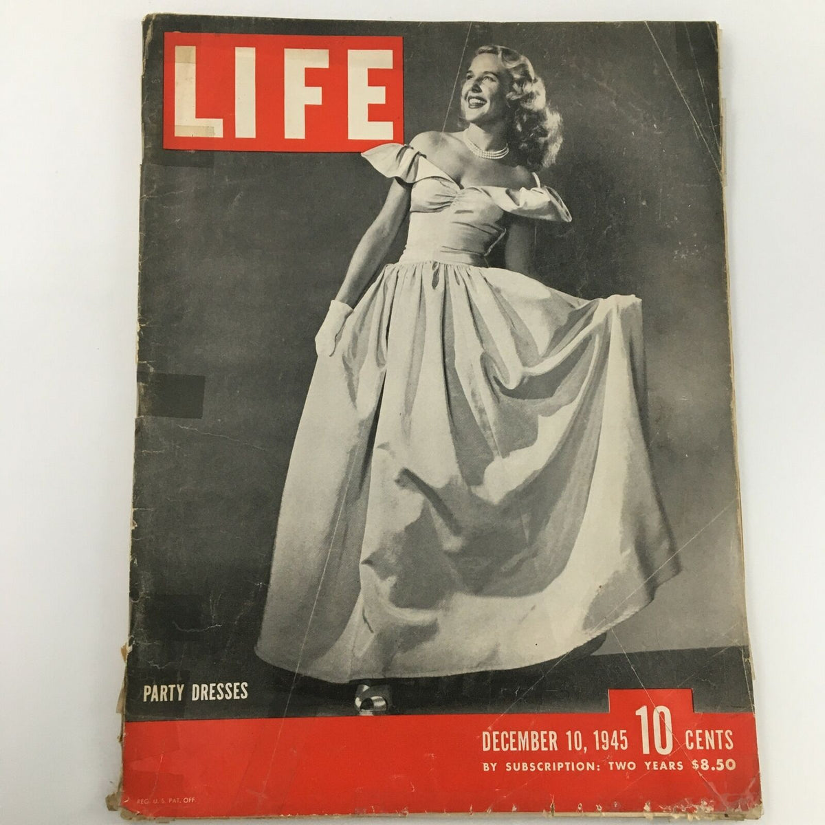 Vintage Life Magazine cover from December 10, 1945 featuring party dresses, showcasing mid-20th century fashion with a model in an elegant gown.