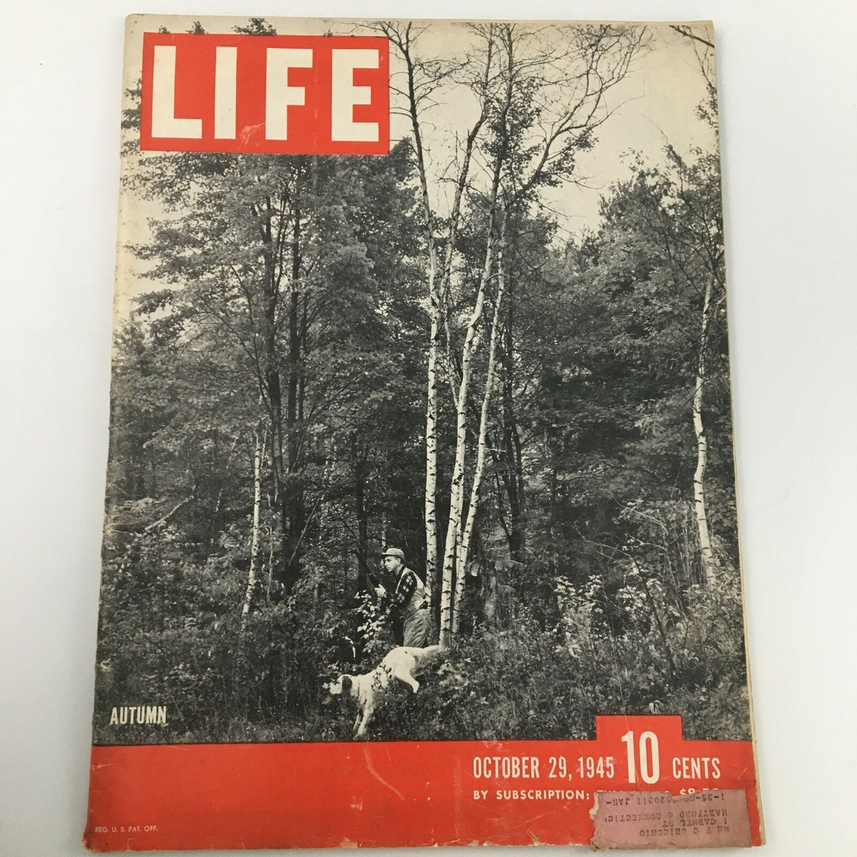 VTG Life Magazine from October 29, 1945, featuring an Autumn forest photograph, showcasing a hunter and his dog amidst the trees.