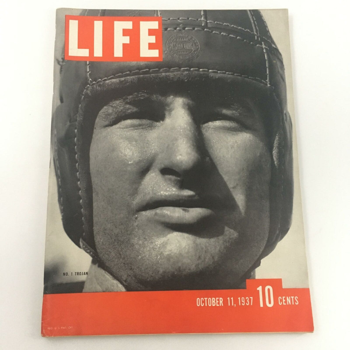 VTG Life Magazine October 11, 1937 featuring Chuck Williams as No. 1 Trojan, showcasing a striking black and white cover design with bold red text.