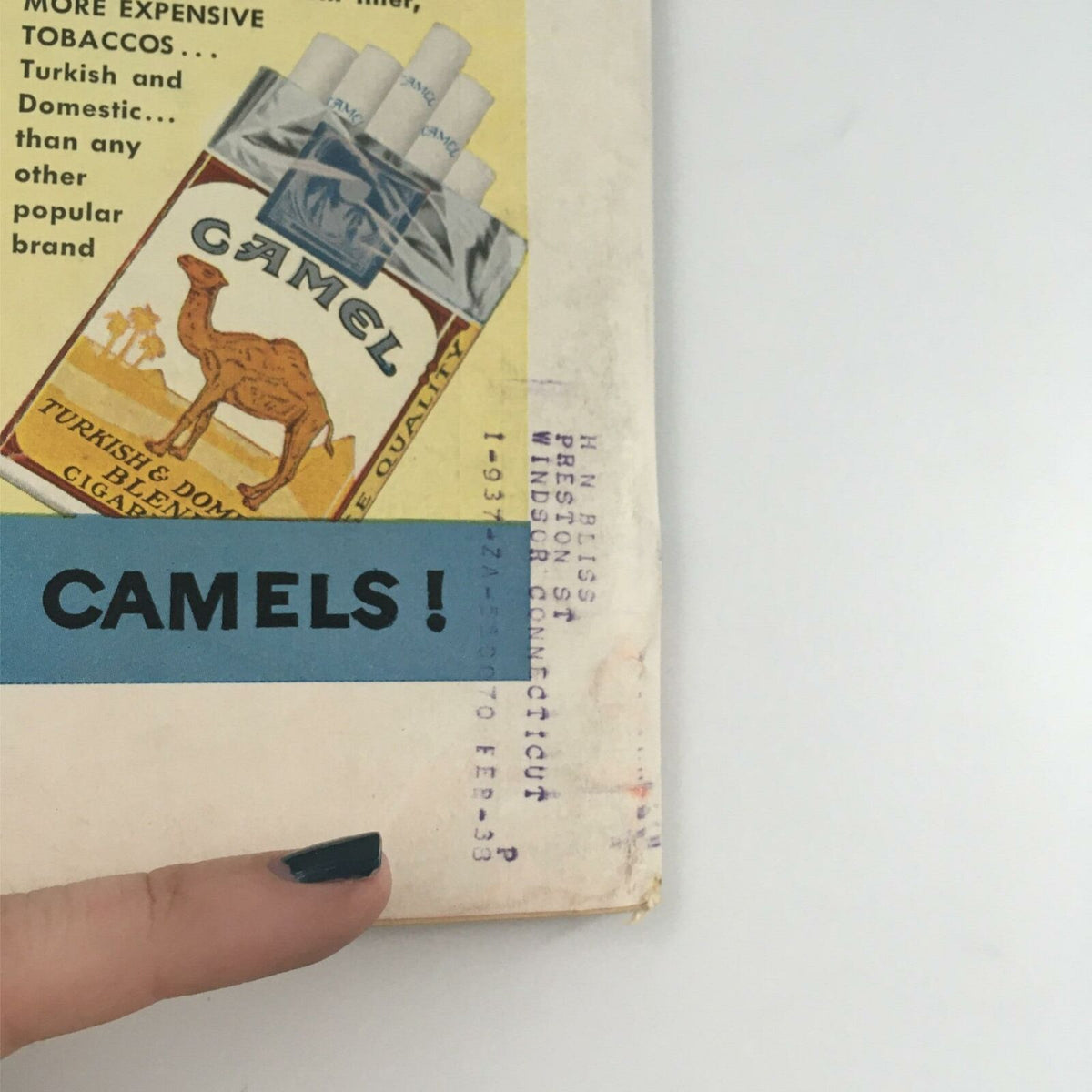 Close-up of the corner of the back cover of VTG Life Magazine from October 11, 1937, highlighting the Camel cigarette advertisement and a printed address.