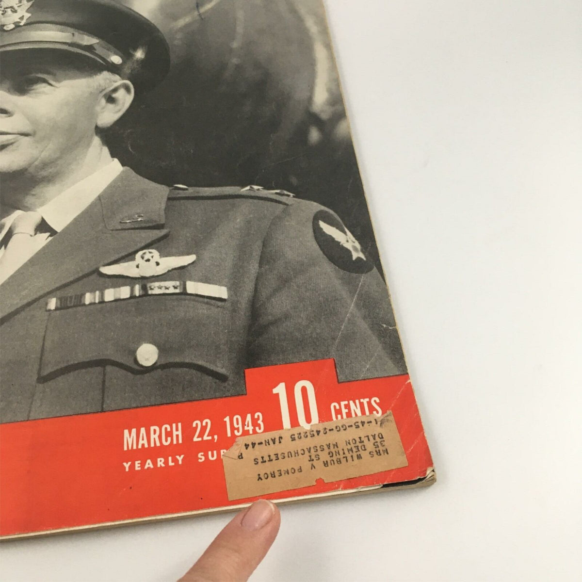 Cover of VTG Life Magazine March 22, 1943, featuring a portrait of George C. Kenney in military uniform, showcasing the date and price of 10 cents, with an address label on display.