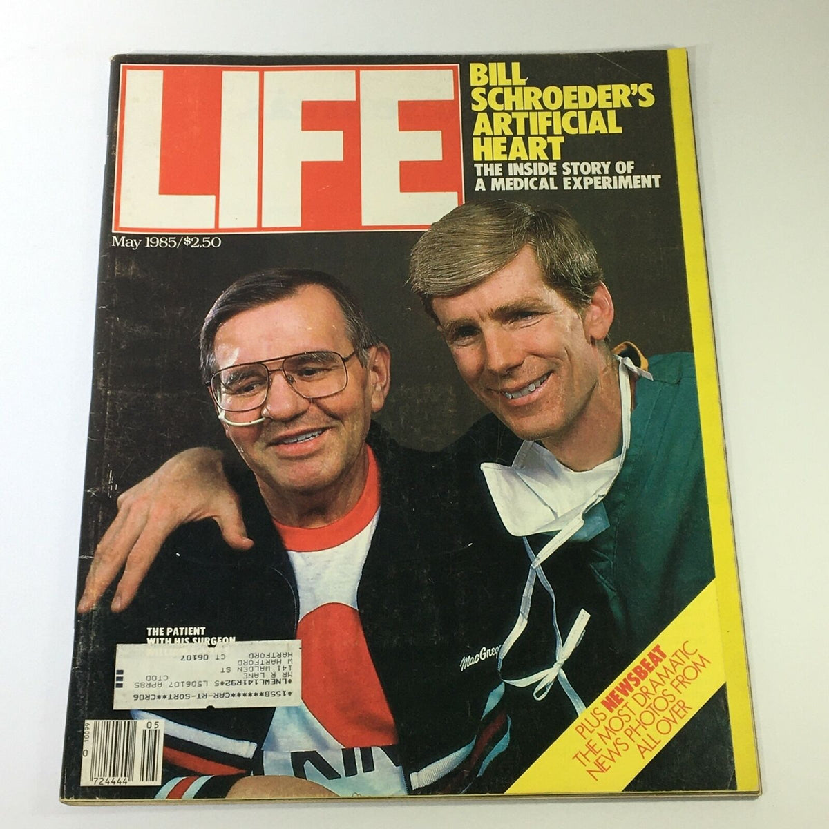 Vintage Life Magazine from May 1985 featuring Bill Schroeder's Artificial Heart on the cover, showcasing the inside story of a medical experiment, with two men smiling, one wearing glasses and the other in scrubs.