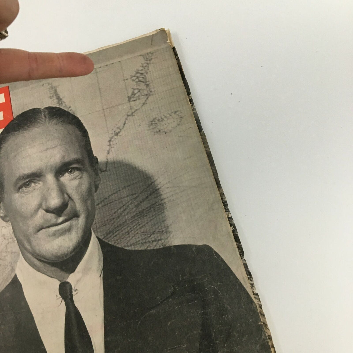 Detail view of the VTG Life Magazine from October 4, 1943, emphasizing the cover art featuring Tony Biddle. The background shows a faint map, adding to the historical significance.