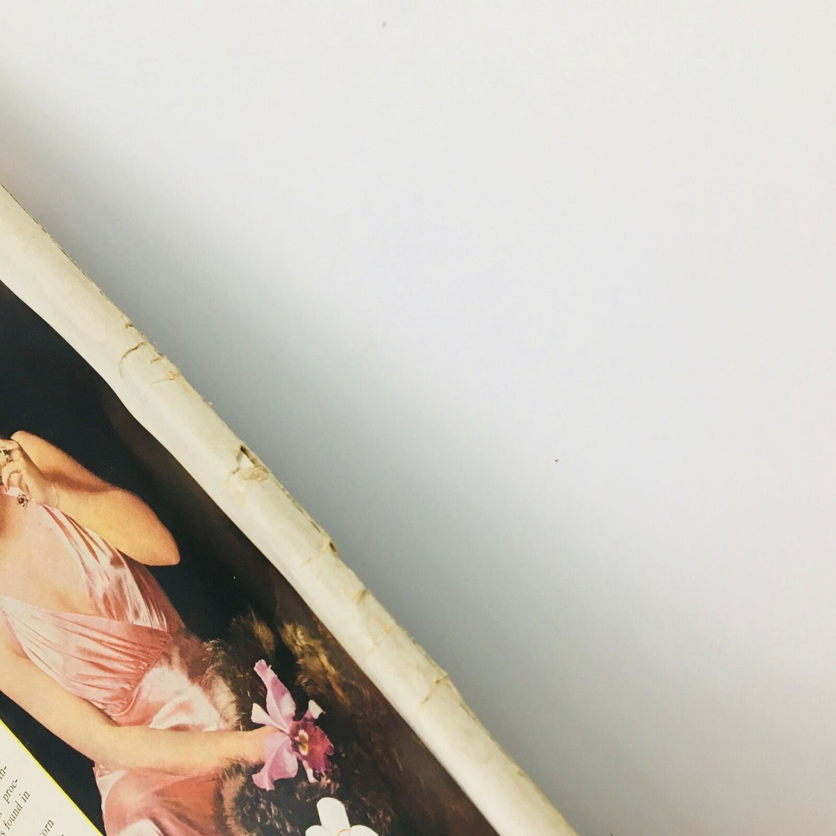 Close-up view of the spine of VTG Life Magazine October 18 1937, exhibiting wear and authenticity of vintage publications.