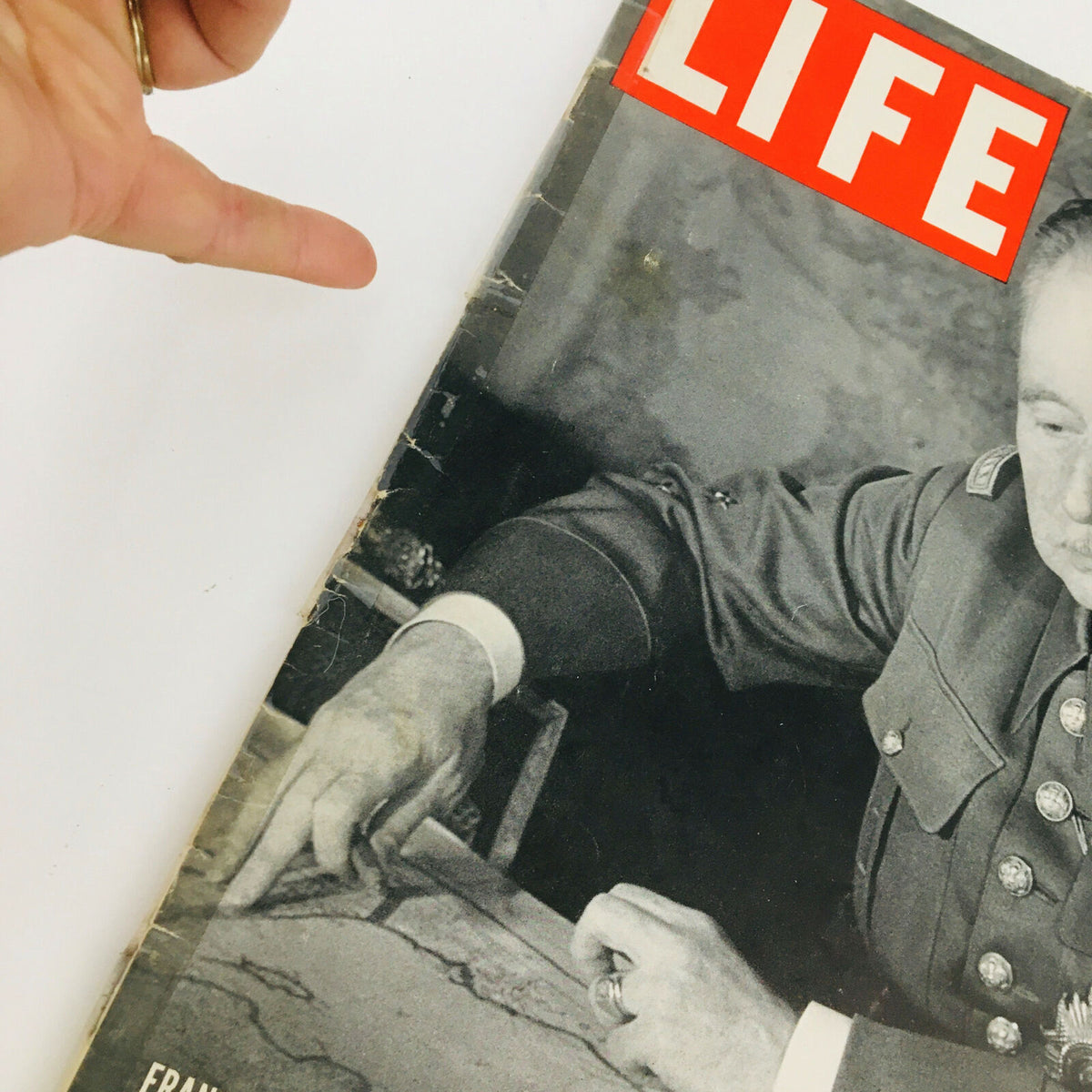 Close-up view of the cover of VTG Life Magazine February 20, 1939 showcasing General Maurice Gamelin's hand pointing to a map.