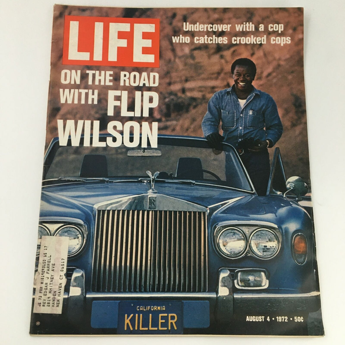 VTG Life Magazine August 4 1972 featuring comedian Flip Wilson on the cover, depicting him on the road with a classic blue Rolls-Royce, highlighting the theme of an undercover cop capturing criminals.