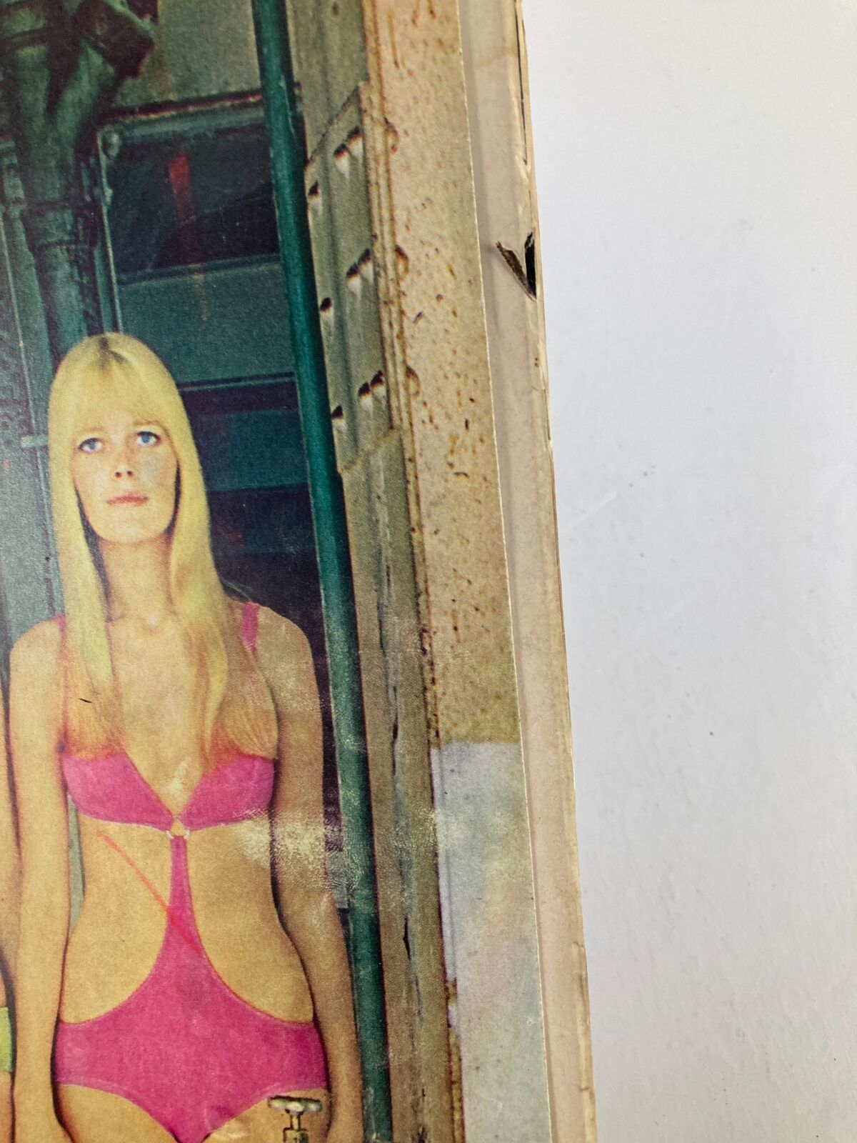 Close-up of a vintage Life Magazine from September 27, 1968, titled 'The Land of Blondes: Sweden's Wild Style,' featuring a model in a vibrant pink swimsuit, capturing the bold fashion trends of the 1960s.
