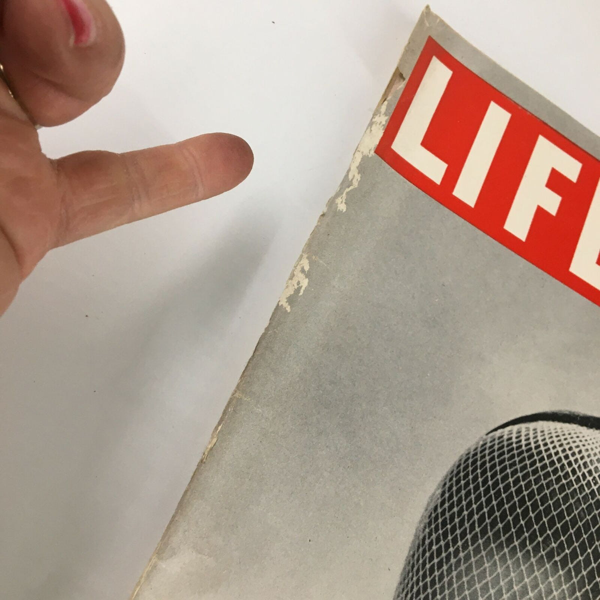 Close-up view showing the edge of the VTG Life Magazine February 12 1951 cover, displaying minor wear and a label, indicative of its vintage condition.