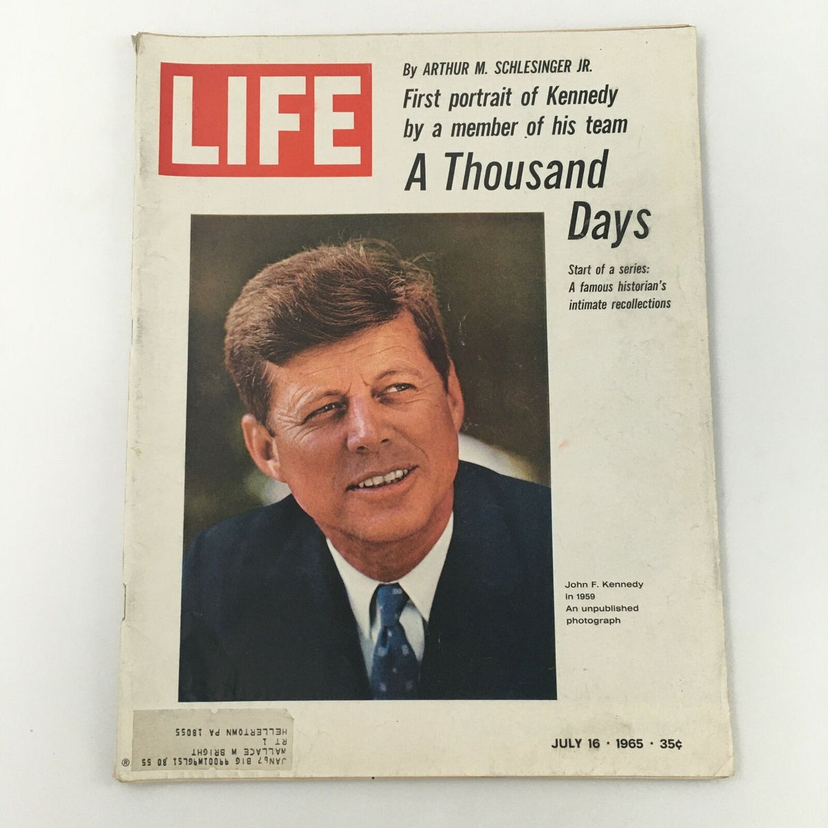 Vintage Life Magazine cover from July 16, 1965 featuring an unpublished photograph of John F. Kennedy. The cover, highlighting JFK, includes the title 'A Thousand Days' and details about a series by historian Arthur M. Schlesinger Jr. Ideal for collectors and history enthusiasts.