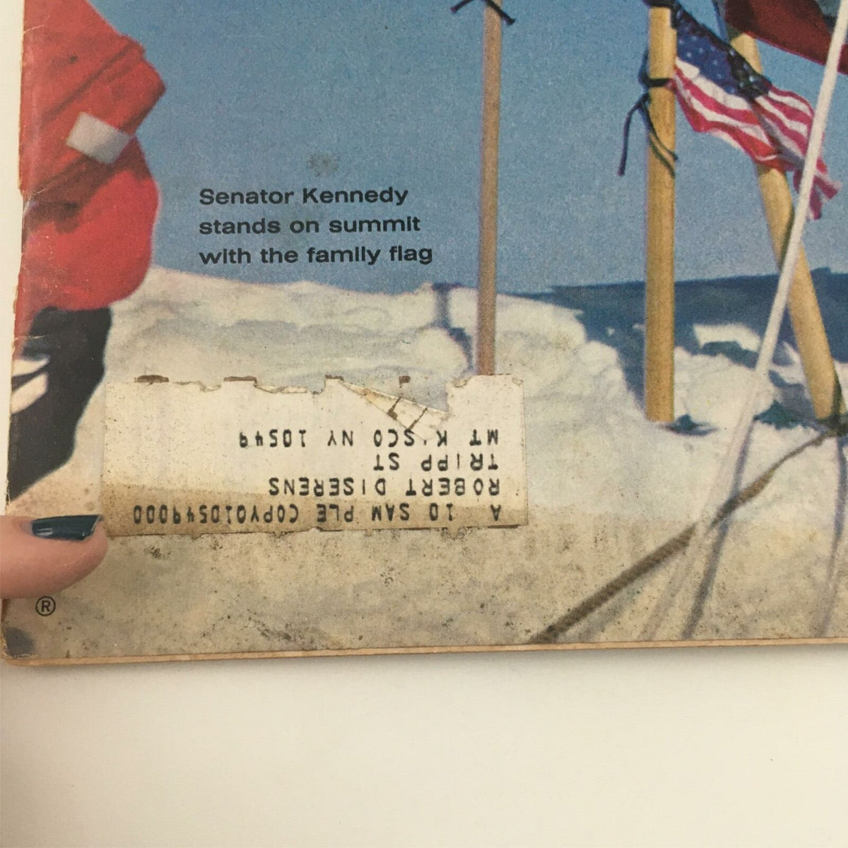 VTG Life Magazine April 9, 1965, featuring Senator Kennedy standing on the summit of Mt. Kennedy with family flags in the background, showcasing an important historical moment.