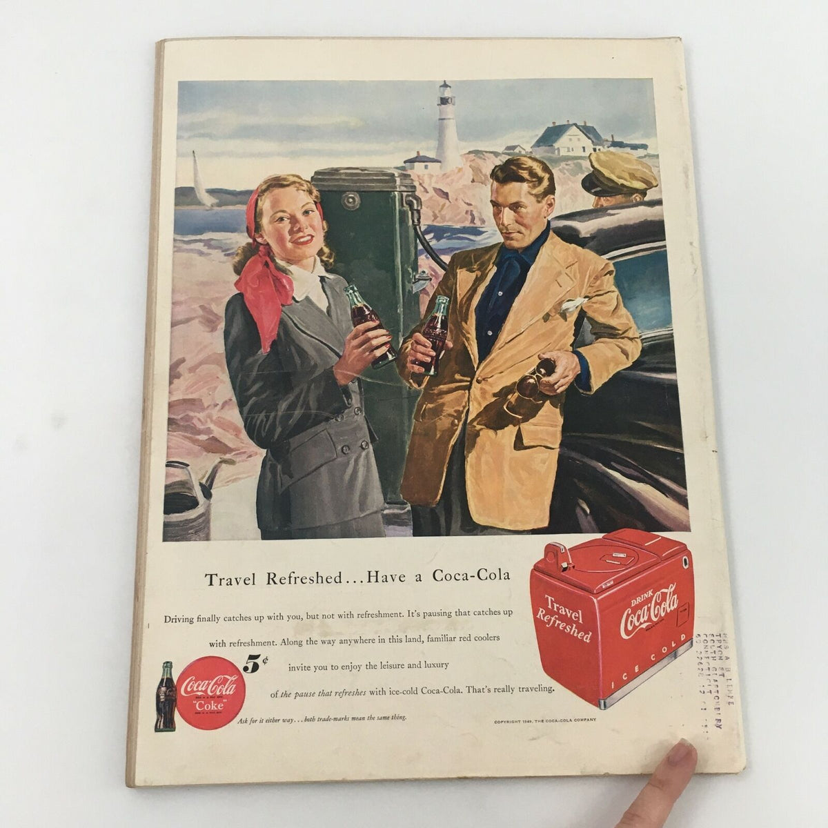 Back cover of VTG Life Magazine May 2, 1949, featuring an advertisement for Coca-Cola, with a couple enjoying drinks at a scenic location, emphasizing a vintage travel theme.
