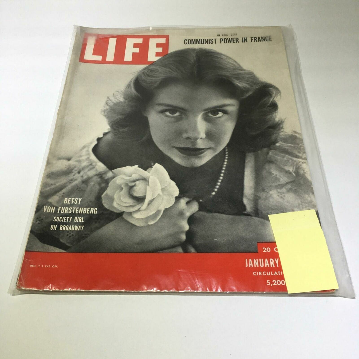Cover of VTG Life Magazine dated January 29, 1951 featuring Betsy Von Furstenberg, a society girl, with a rose in hand and a classic hairstyle, showcasing vintage American culture.
