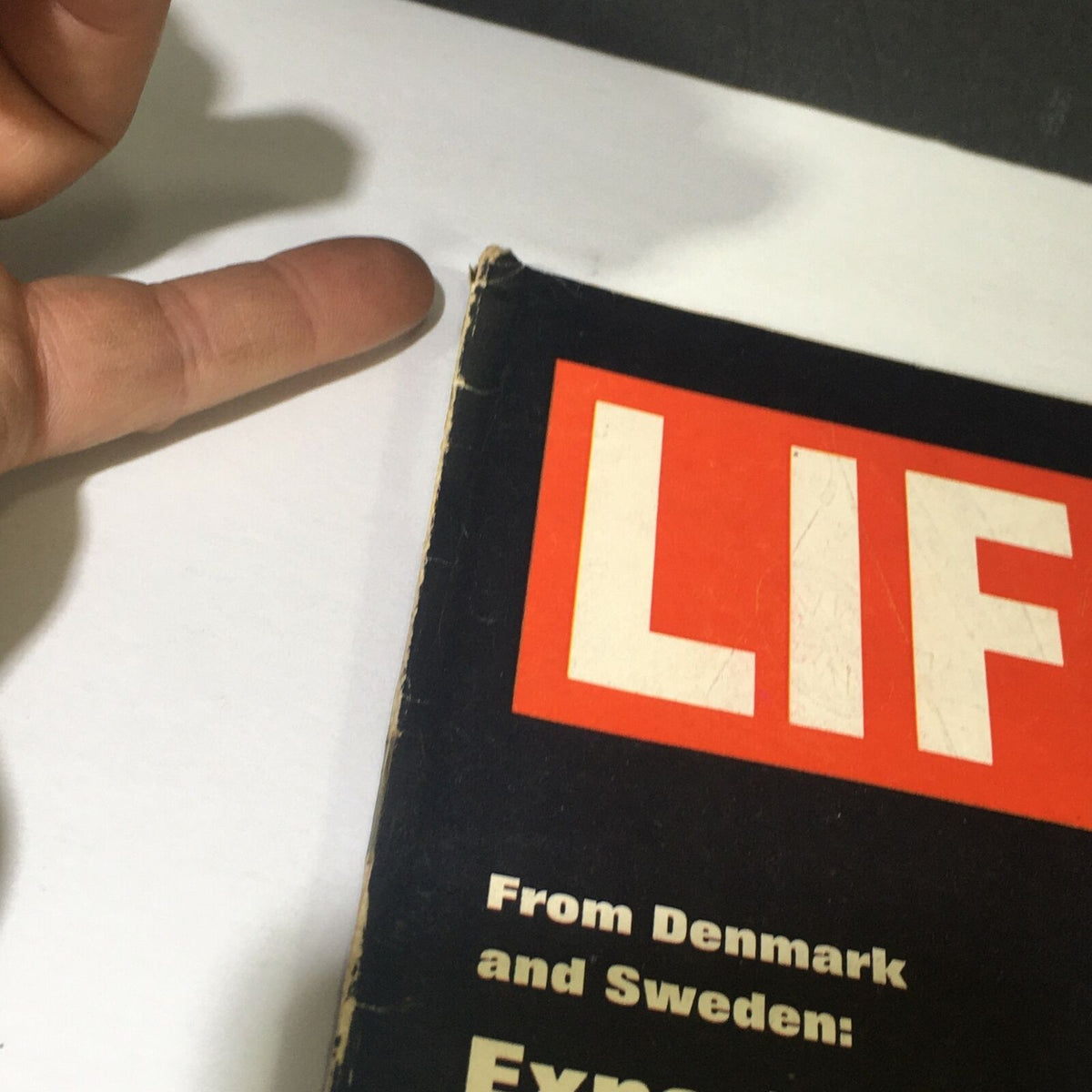 Close-up of the VTG Life Magazine August 15 1969, featuring the title 'LIF' and the subtitle 'From Denmark and Sweden: Experiments in Marriage' along the edge of the cover.