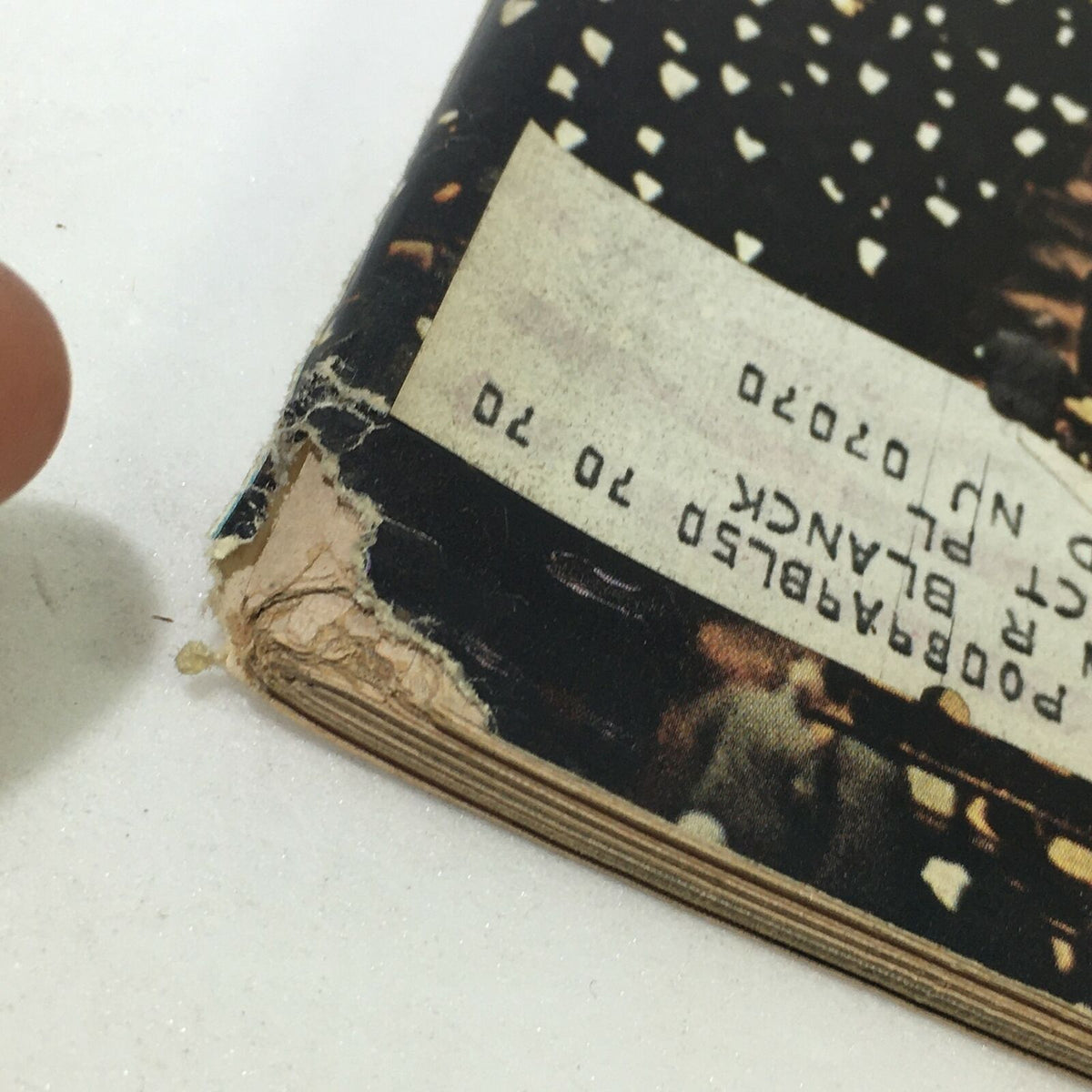 Close-up of the spine of the Vintage Life Magazine from October 15, 1965, showing signs of wear and an address label for authenticity.