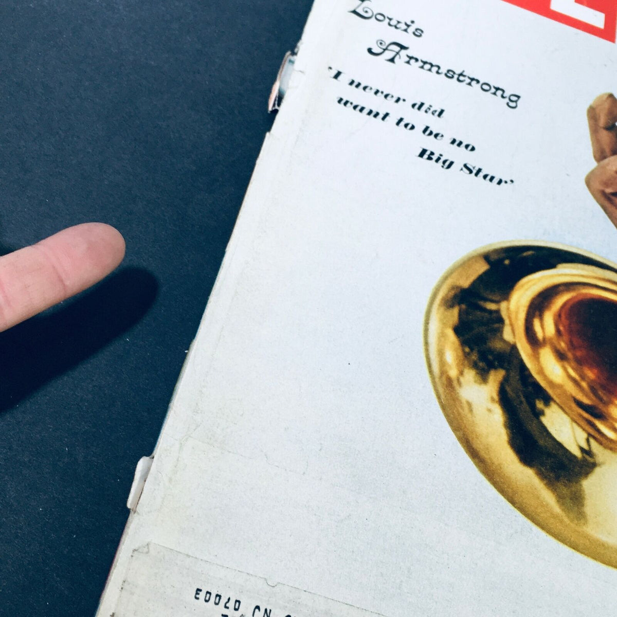 Close-up of VTG Life Magazine April 15 1966 cover with Louis Armstrong, emphasizing details of the magazine's vintage appeal.
