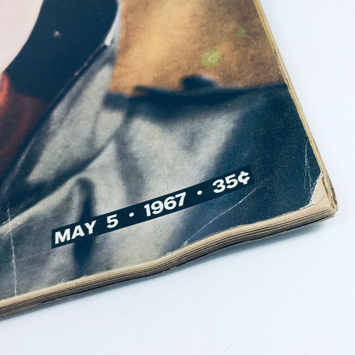 Close-up of the bottom corner of the Vintage Life Magazine dated May 5, 1967, showing the publication date and price of 35 cents, enhancing its authenticity as a collectible item.