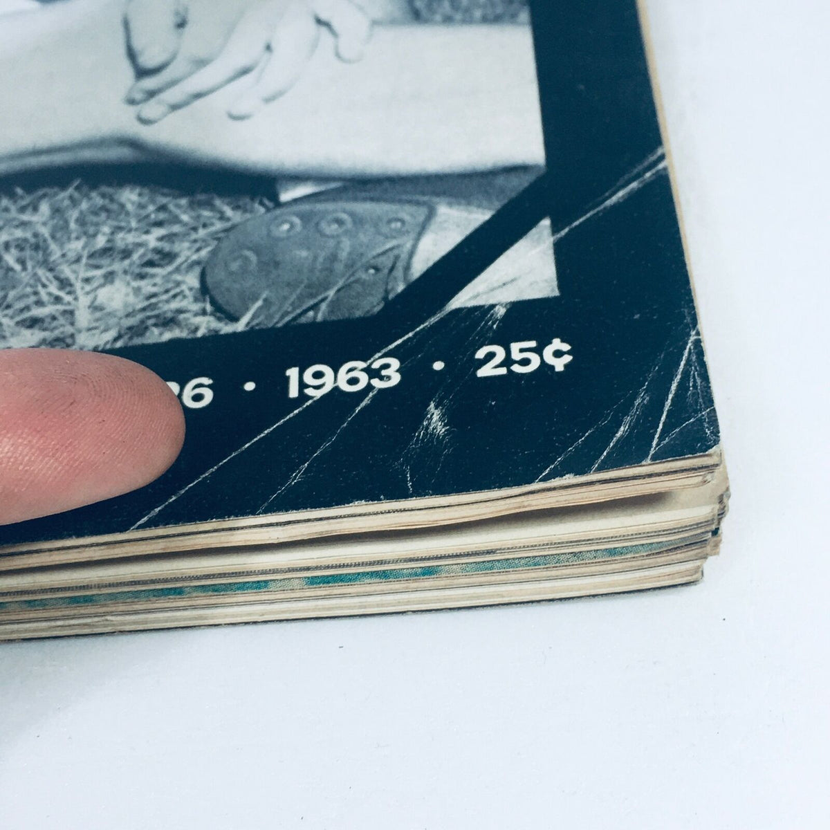 Close-up view of the spine of the Life Magazine from April 26, 1963, showcasing its vintage condition with noticeable wear, relevant to collectors and history enthusiasts.