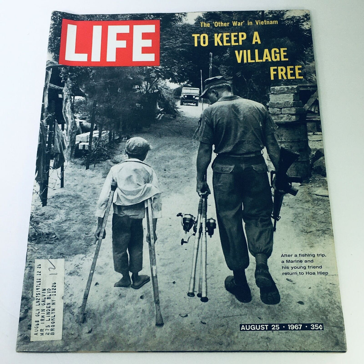 Cover of Vintage Life Magazine August 25 1967 - The Other War in Vietnam, featuring a Marine walking alongside a child on crutches, reflecting historical themes from the Vietnam War era.