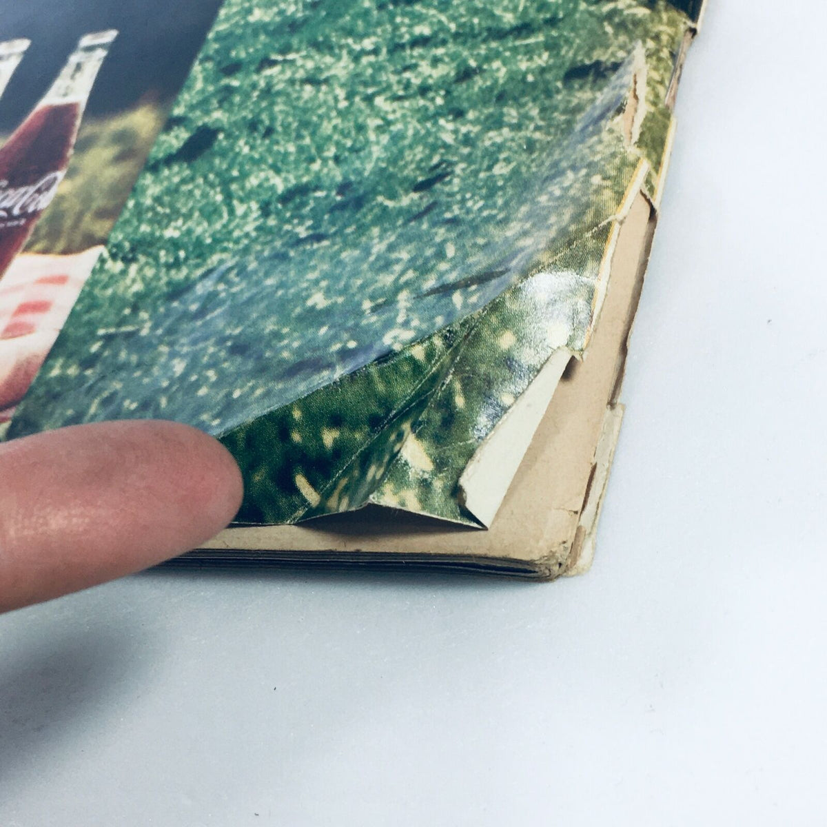 Detail close-up of the spine and corner of the VTG Life Magazine April 11, 1969, showing some wear and tear, indicative of its vintage condition.