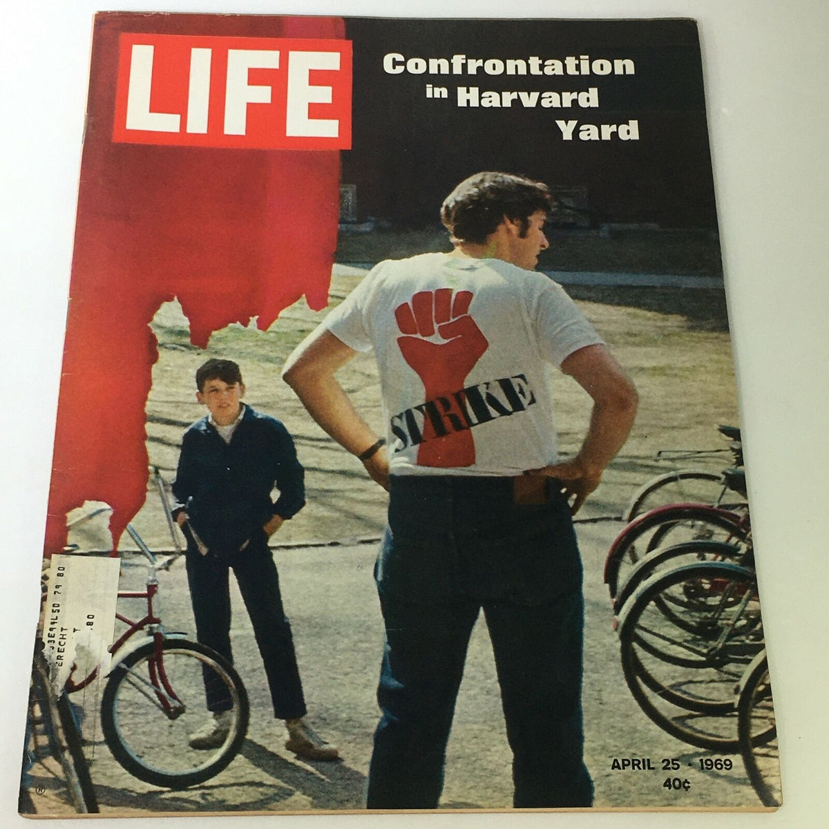 VTG Life Magazine April 25, 1969 featuring the cover story "Confrontation in Harvard Yard" showcasing a young man wearing a 'Strike' t-shirt with historical significance.