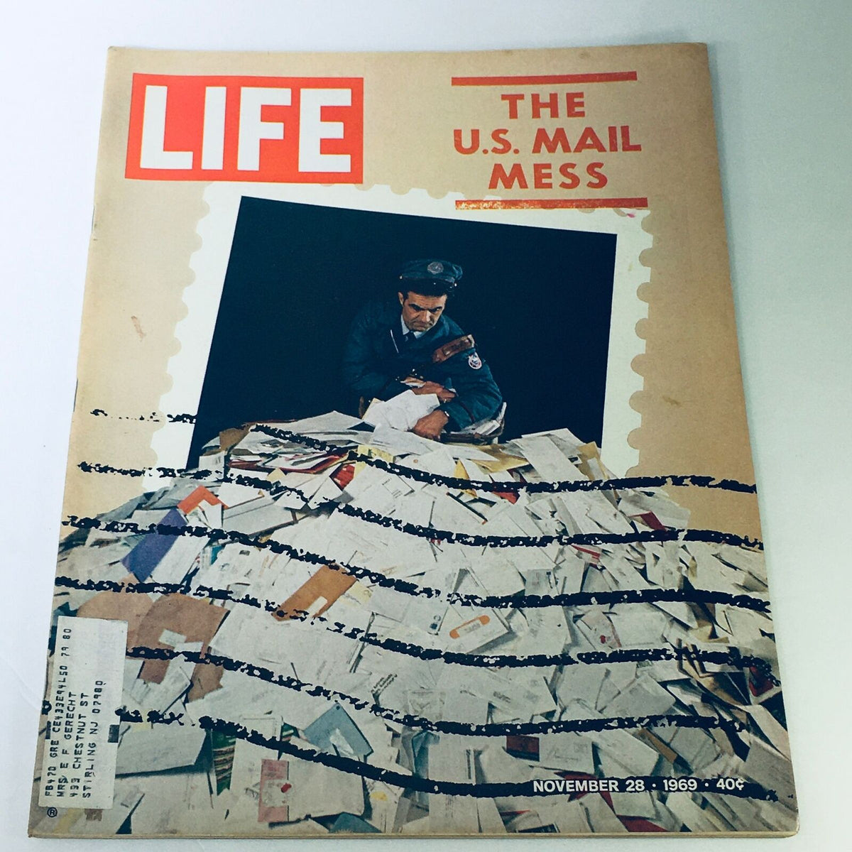 Vintage Life Magazine cover from November 28, 1969, titled 'The U.S. Mail Mess,' featuring a postal worker surrounded by piles of letters, reflecting historical challenges in the U.S. postal service.