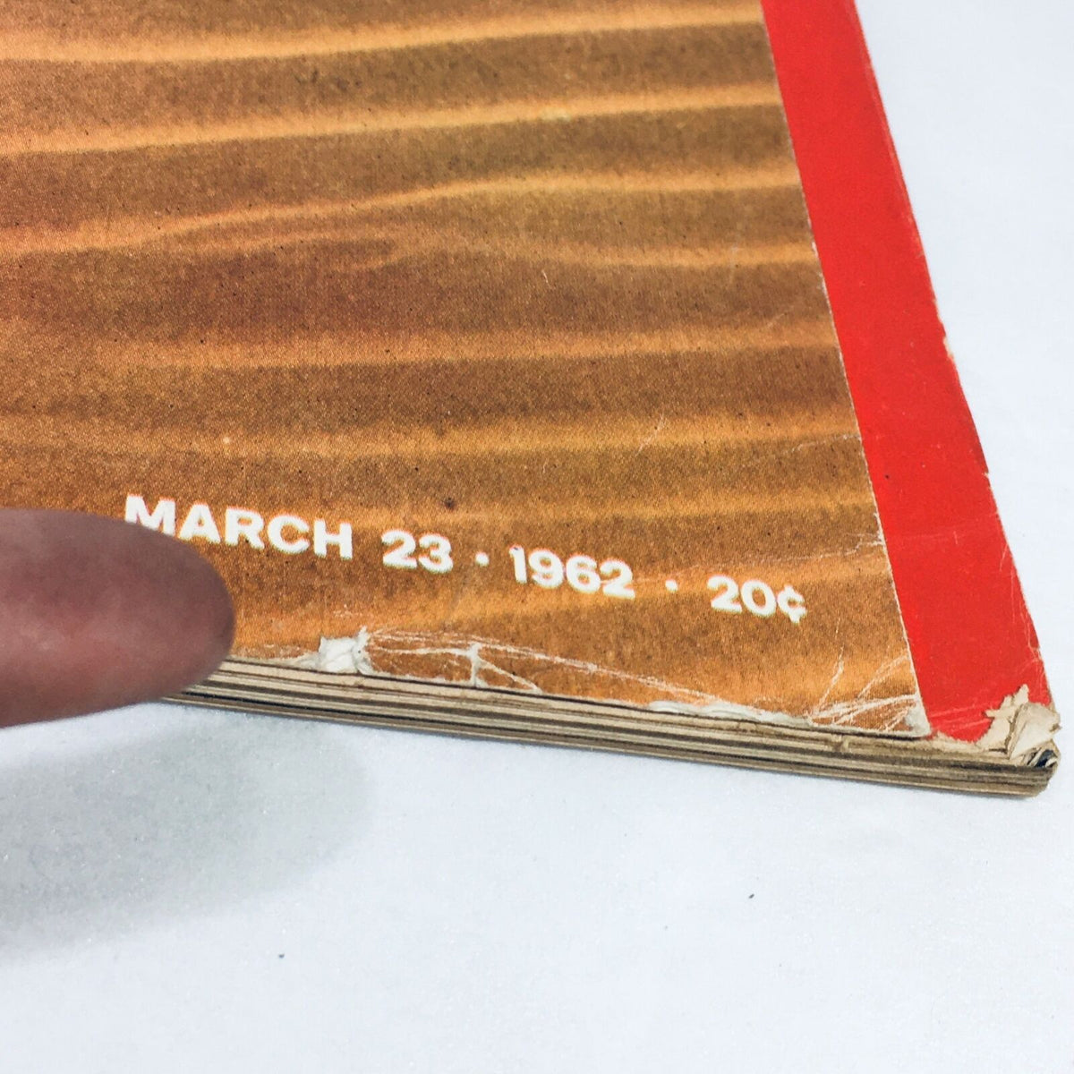 Close-up view of the spine of VTG Life Magazine March 23, 1962, showcasing the publication date and price, emphasizing its vintage appeal related to Richard Nixon's story.