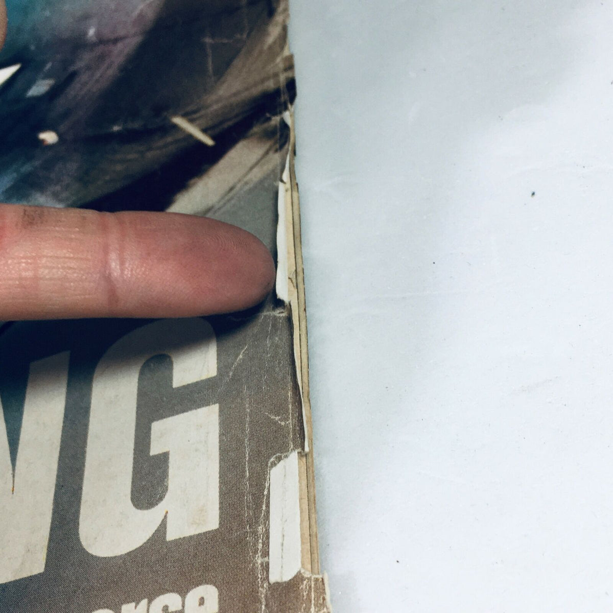 Close-up of the edge of the Vintage Life Magazine August 11, 1972, highlighting minor wear and rips, emphasizing the magazine's vintage character that includes 'The Secret Bobby Fischer' and Skyjacking.