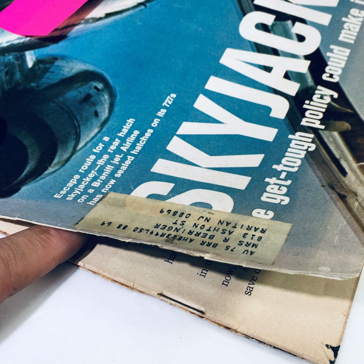 Close-up view of the cover of the vintage Life Magazine August 11, 1972, featuring the article on 'Skyjacking' with a visible address label and wear on the edges, reflecting its historical significance.