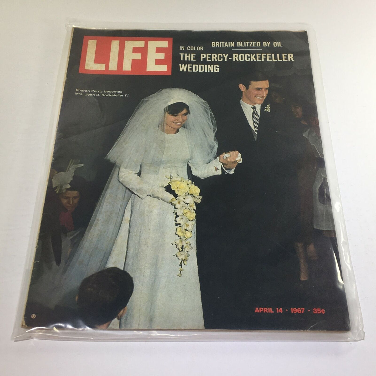 Vintage Life Magazine from April 14, 1967, featuring the wedding of Sharon Percy and John D. Rockefeller IV on the cover, showcasing the bride in a flowing white gown with a veil.