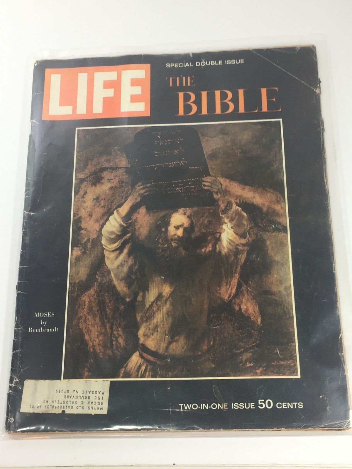 Vintage Life Magazine cover from December 25, 1964, featuring a special edition on 'The Bible & Moses' by Rembrandt. The cover showcases a remarkable artwork of Moses holding the Ten Commandments, along with bold titles indicating its historical and cultural significance.