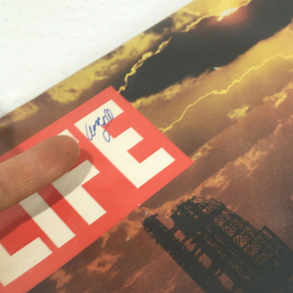 Close-up of the top corner of the VTG Life Magazine cover from February 28, 1969, showing the issue's title and a handwritten signature or note.