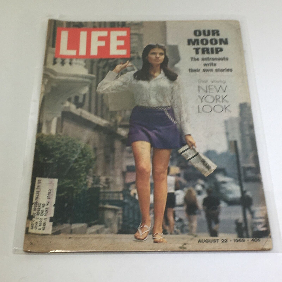 Vintage Life Magazine cover from August 22, 1969, showcasing a woman in a fashionable outfit representing the New York Look, with a feature on astronauts and the moon trip.