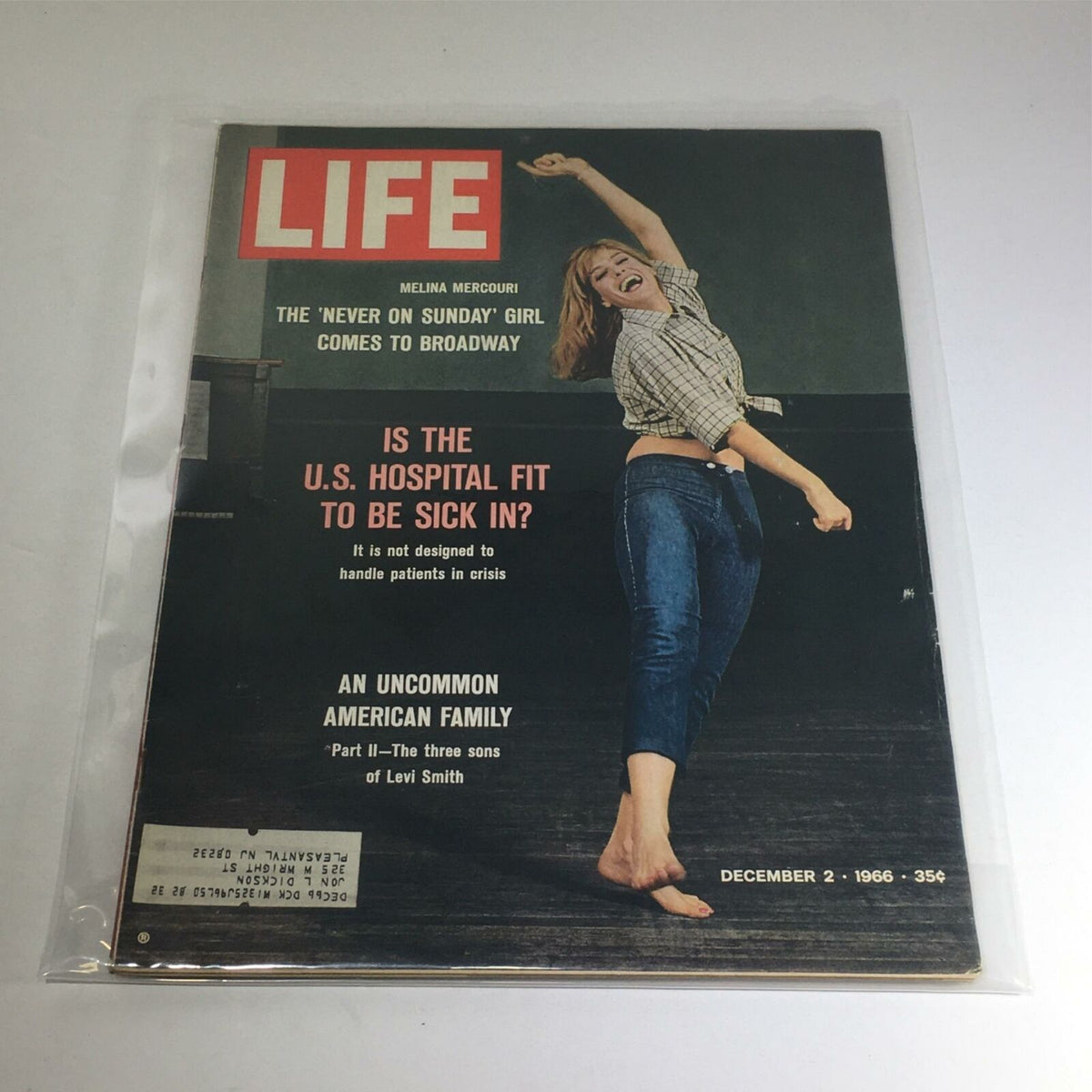 Cover of VTG Life Magazine from December 2, 1966, featuring Melina Mercouri, known as the 'Never On Sunday Girl,' striking a joyful pose with arms raised.