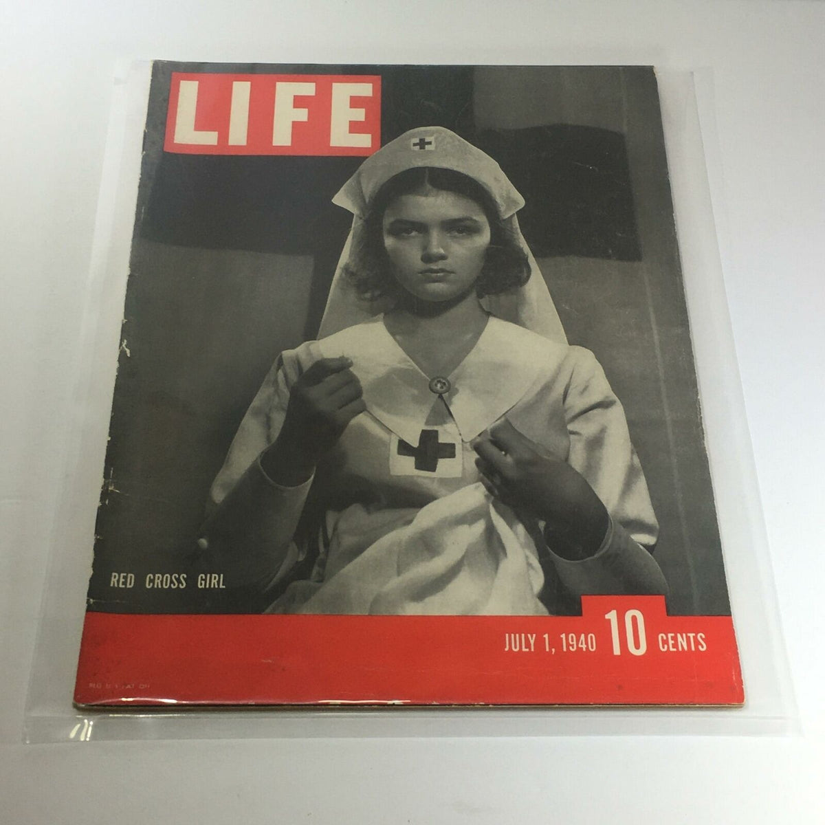 Vintage Life Magazine cover from July 1, 1940, featuring the Red Cross Girl, showcasing historical design and cultural significance.
