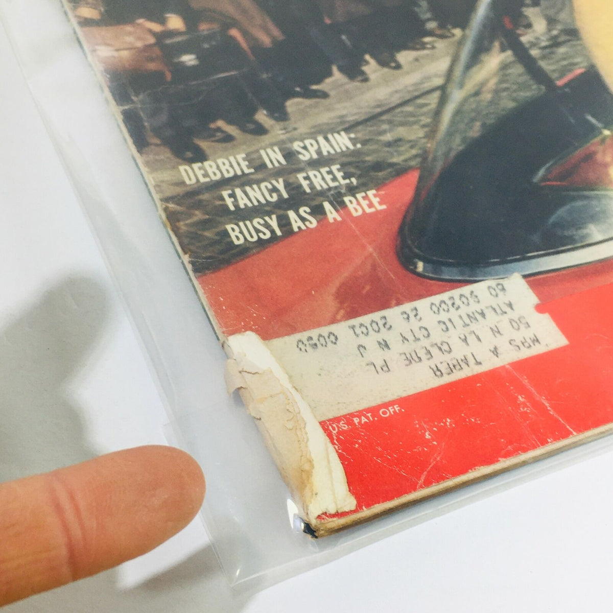 Close-up of the VTG Life Magazine cover from March 30, 1959 highlighting wear and tear, including an address label and a torn corner, emphasizing its vintage condition.