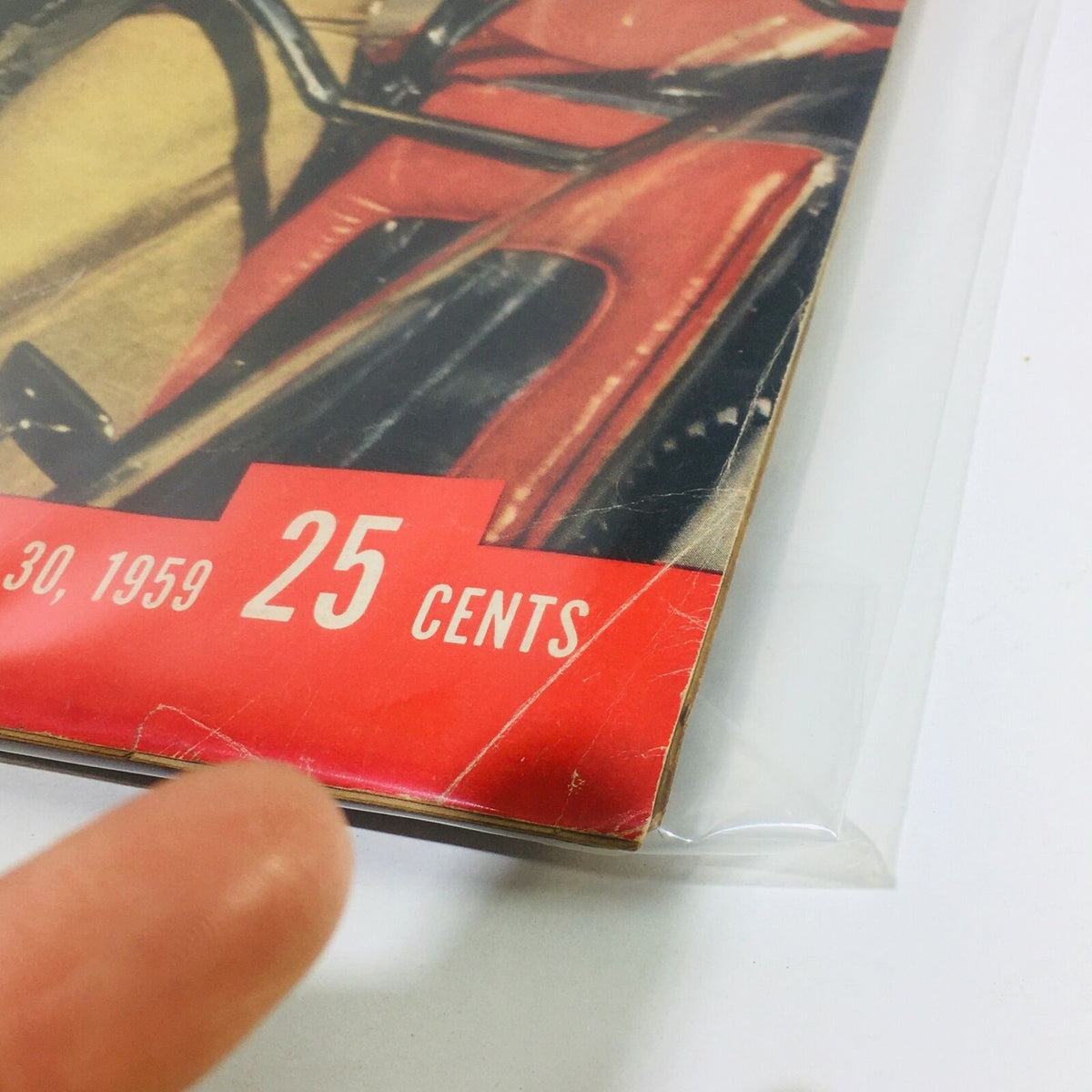 Detail of the VTG Life Magazine from March 30, 1959 showing the corner with a price tag of 25 cents, indicating the magazine's historical value and age.