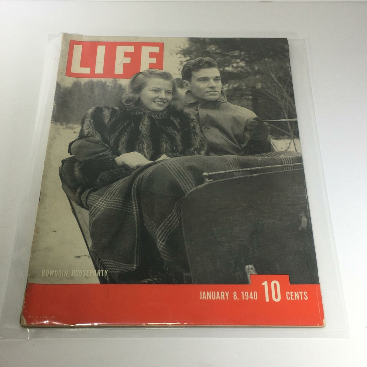 Vintage Life Magazine Cover from January 8, 1940 featuring a couple by Bowdoin Houseparty, showcasing the charm of 1940s style and elegance.