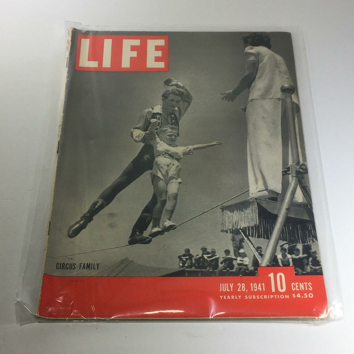 Cover of Vintage Life Magazine dated July 28, 1941, featuring a circus family performing on a tightrope. The title prominently displayed and the magazine highlights WWII themes.