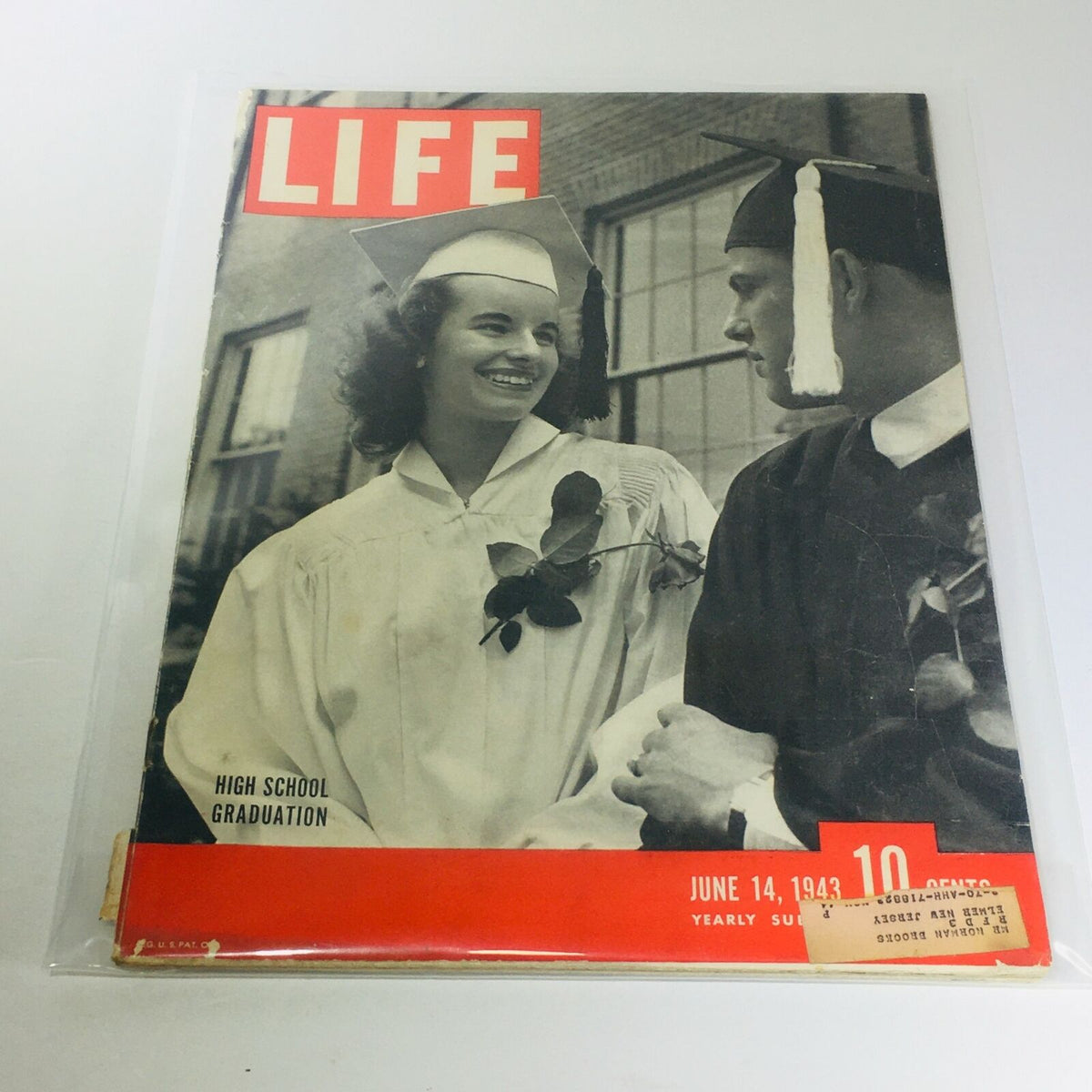 Vintage Life Magazine June 14, 1943 High School Graduation cover featuring a joyful graduate in her cap and gown.