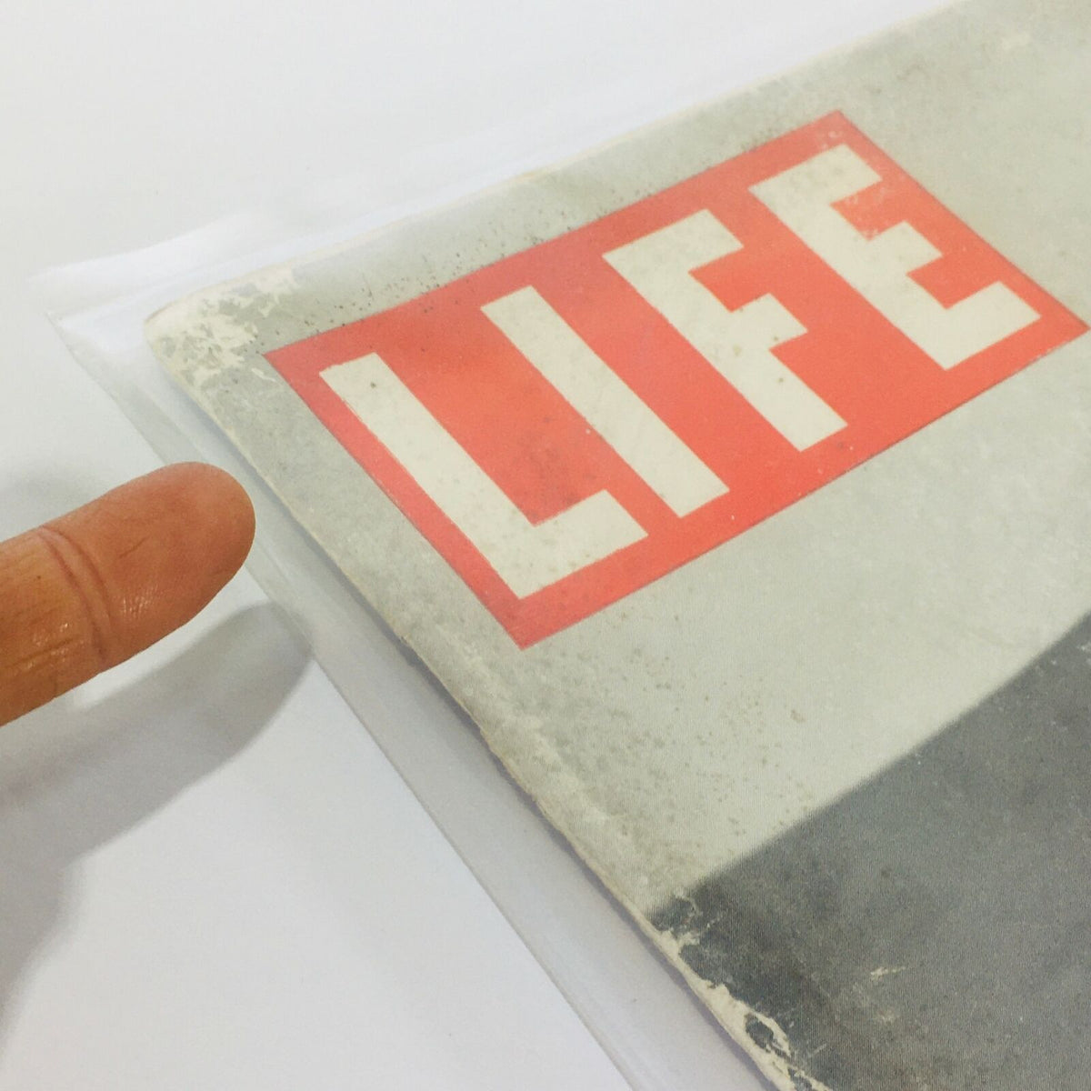 Close-up of the cover of VTG Life Magazines: January 3 1944 - Alaska Holiday / New Guinea Rescue, featuring the name 'LIFE' prominently displayed in red against a vintage background.