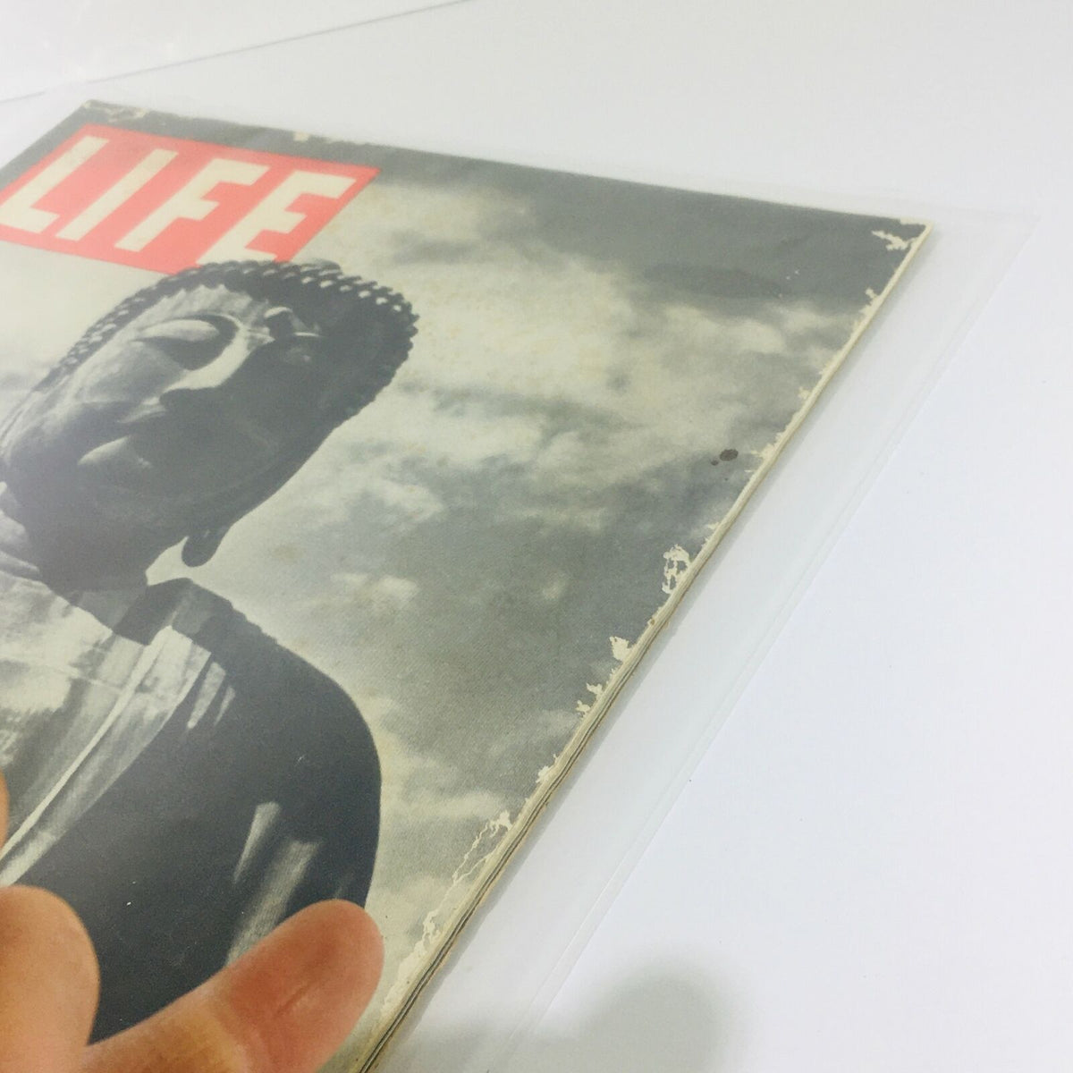 Cover of the vintage Life Magazine from October 8, 1945, featuring a statue of Buddha against a cloudy background.