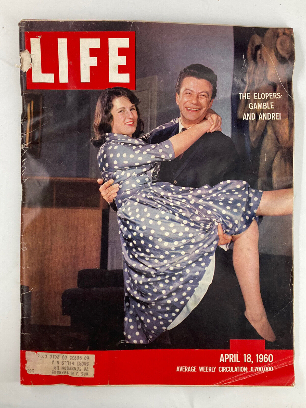 Cover of Life Magazine from April 18, 1960 featuring 'The Elopers Gamble' and 'Andrei Spring in Central Park', showing a couple with the woman in a polka dot dress being held by the man.