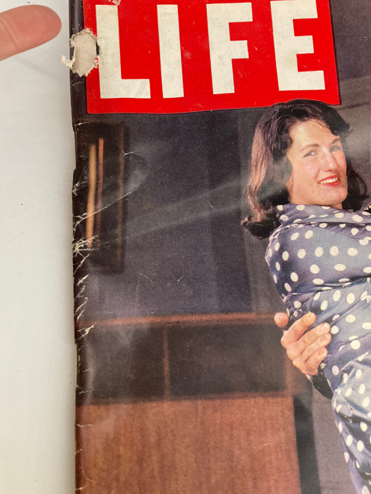 Close-up view of the Life Magazine cover from April 18, 1960 showcasing 'The Elopers Gamble', with visible wear and tear on the magazine's spine.