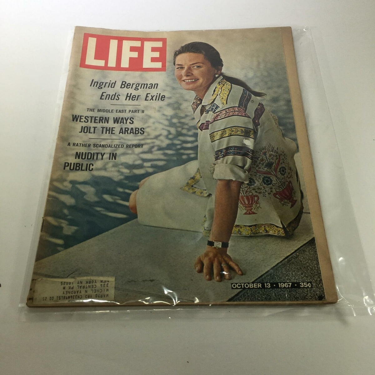 Life Magazine cover from October 13, 1967, featuring Ingrid Bergman, titled 'Ingrid Bergman Ends Her Exile'. This vintage magazine showcases Bergman smiling, wearing a colorful patterned shirt, positioned by a pool, highlighting a significant moment in classic cinema history.