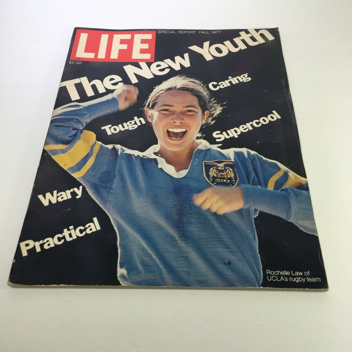 Cover of Life Magazine: Fall 1977 Special Report featuring Rochelle Law of UCLA's Rugby Team, showcasing her enthusiastic expression and vintage sports theme.