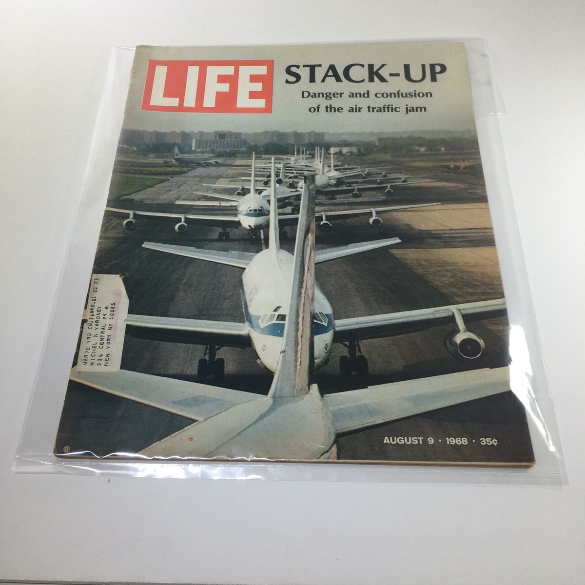 Vintage Life Magazine cover from August 9, 1968, featuring the title 'Stack-Up: Danger and Confusion of the Air Traffic Jam,' showcasing multiple planes lined up on a runway, encapsulating a moment of urban transportation challenges.
