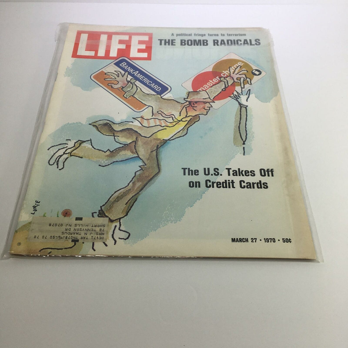 Cover of Life Magazine March 27, 1970, featuring the illustration titled 'The Bomb Radicals' with credit cards, highlighting the rise of consumer culture in the U.S.