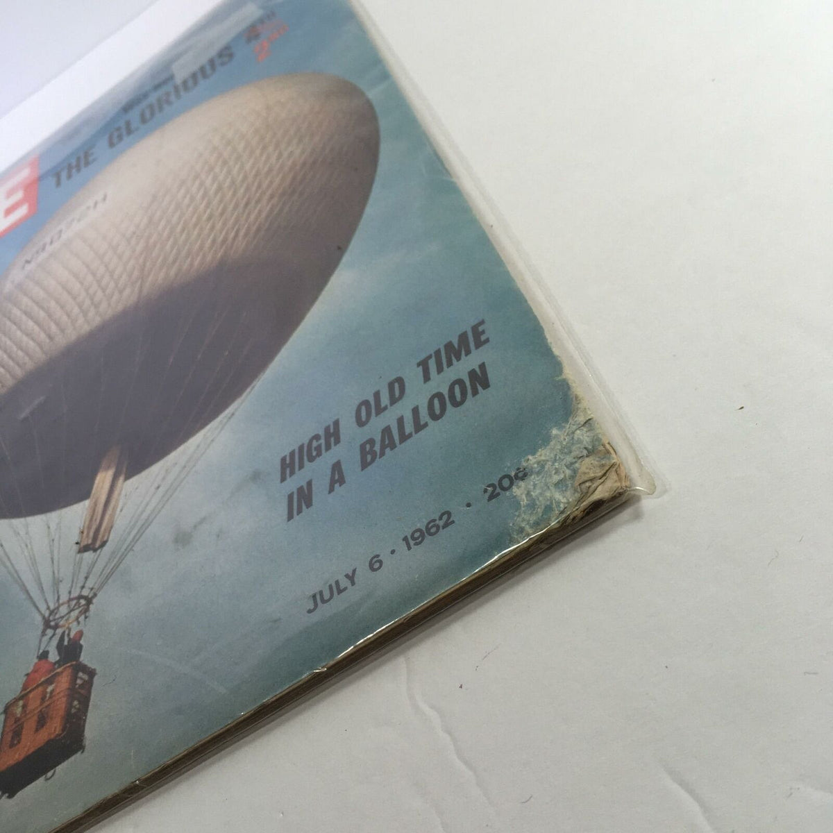 Close-up view of Life Magazine July 6 1962 showcasing David Rockefeller's letter to JFK, depicting a hot air balloon.