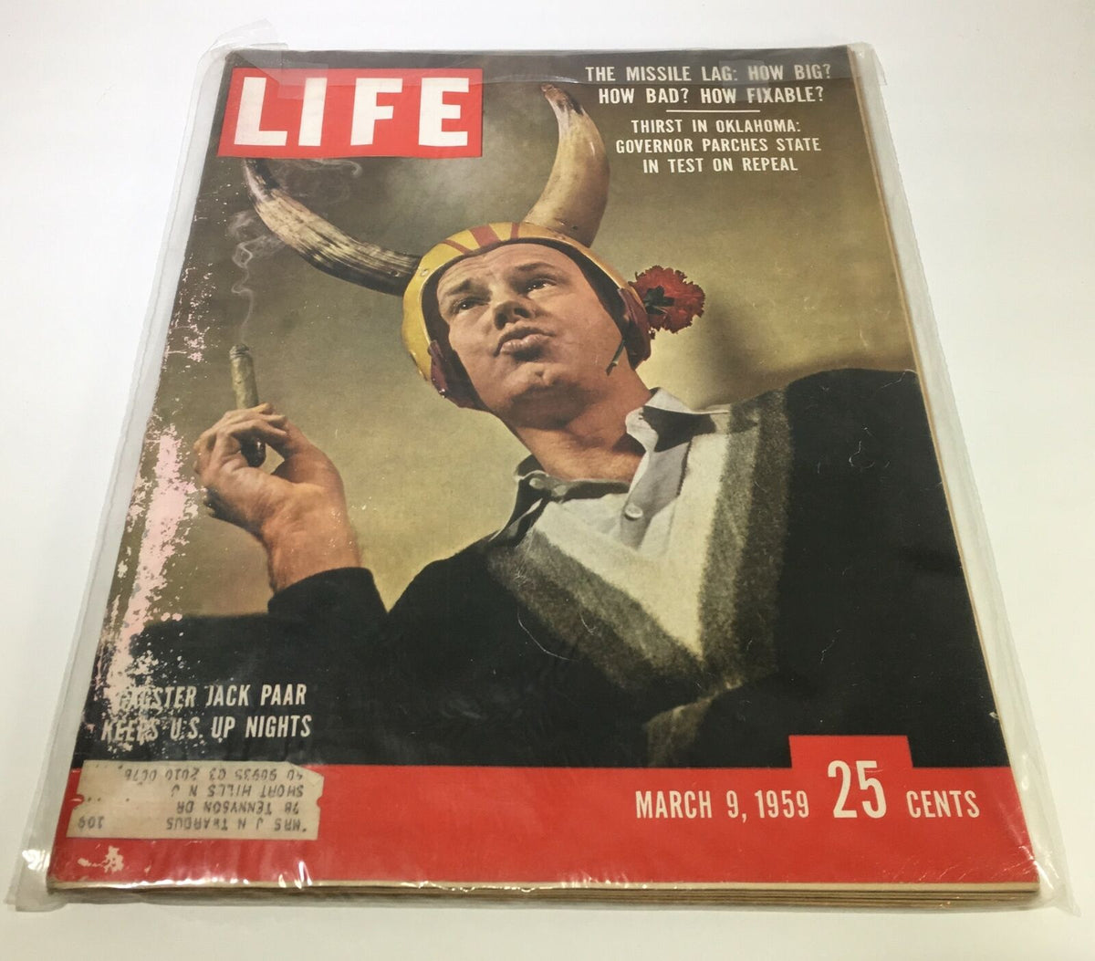 Cover of Life Magazine from March 9, 1959, featuring gagster Jack Paar with a playful expression, wearing a horned helmet. This vintage magazine highlights American culture and nostalgic moments, perfect for collectors.